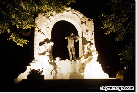 ohann Strauss statue at night